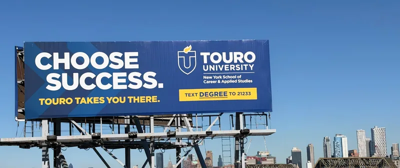 Touro University campaign billboard on the BQE in New York City, designed by PR Brand Marketing